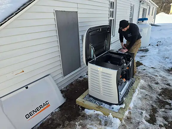 MC Electrical technician installing Generac generator at residential property