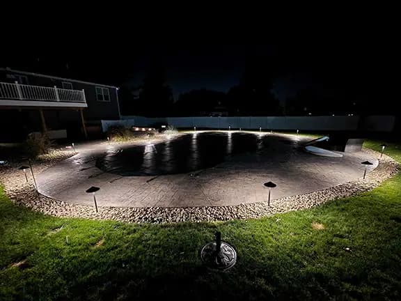 Pool area with complete perimeter and ground-level lighting design