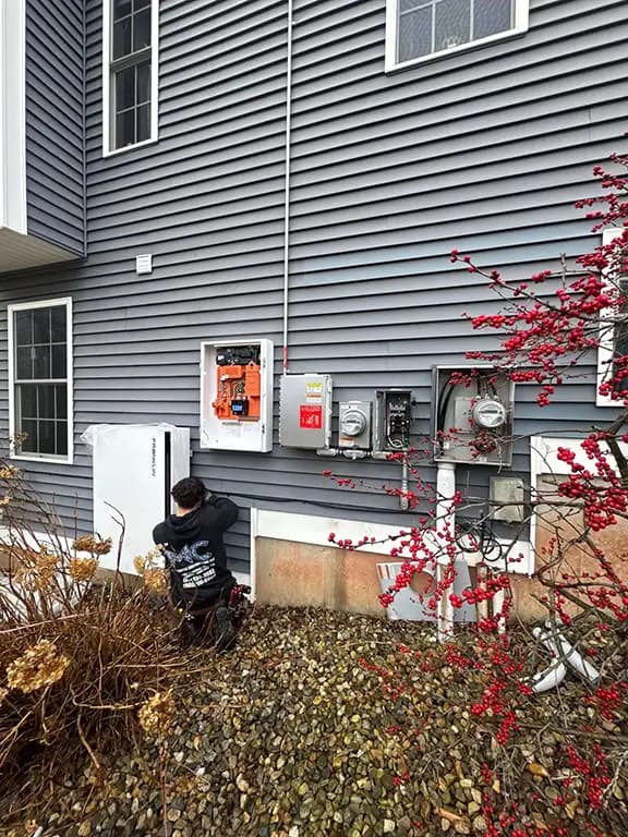 Solar panel installation on residential home with MC Electrical van