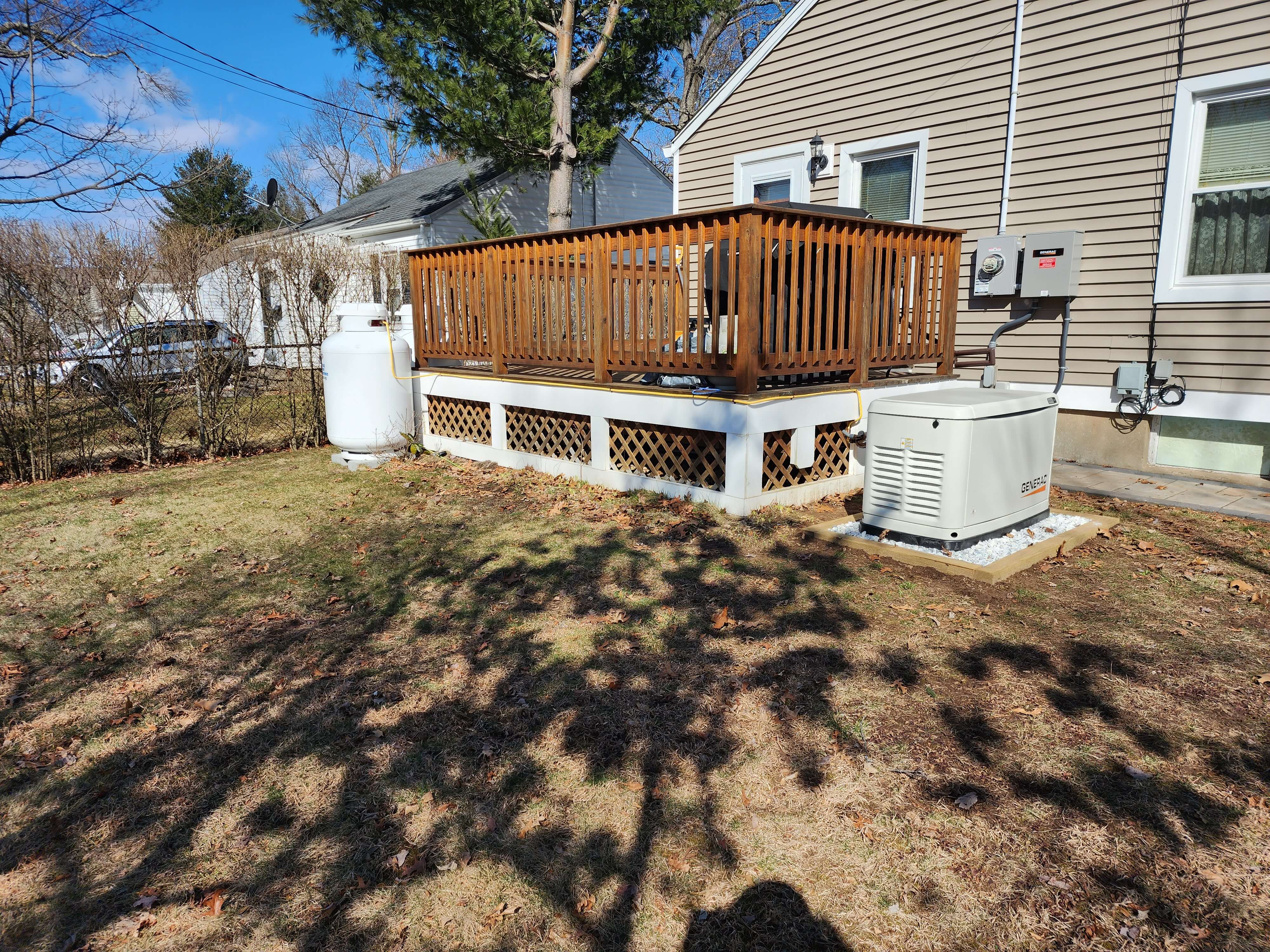 Complete generator setup with propane tank and transfer switch