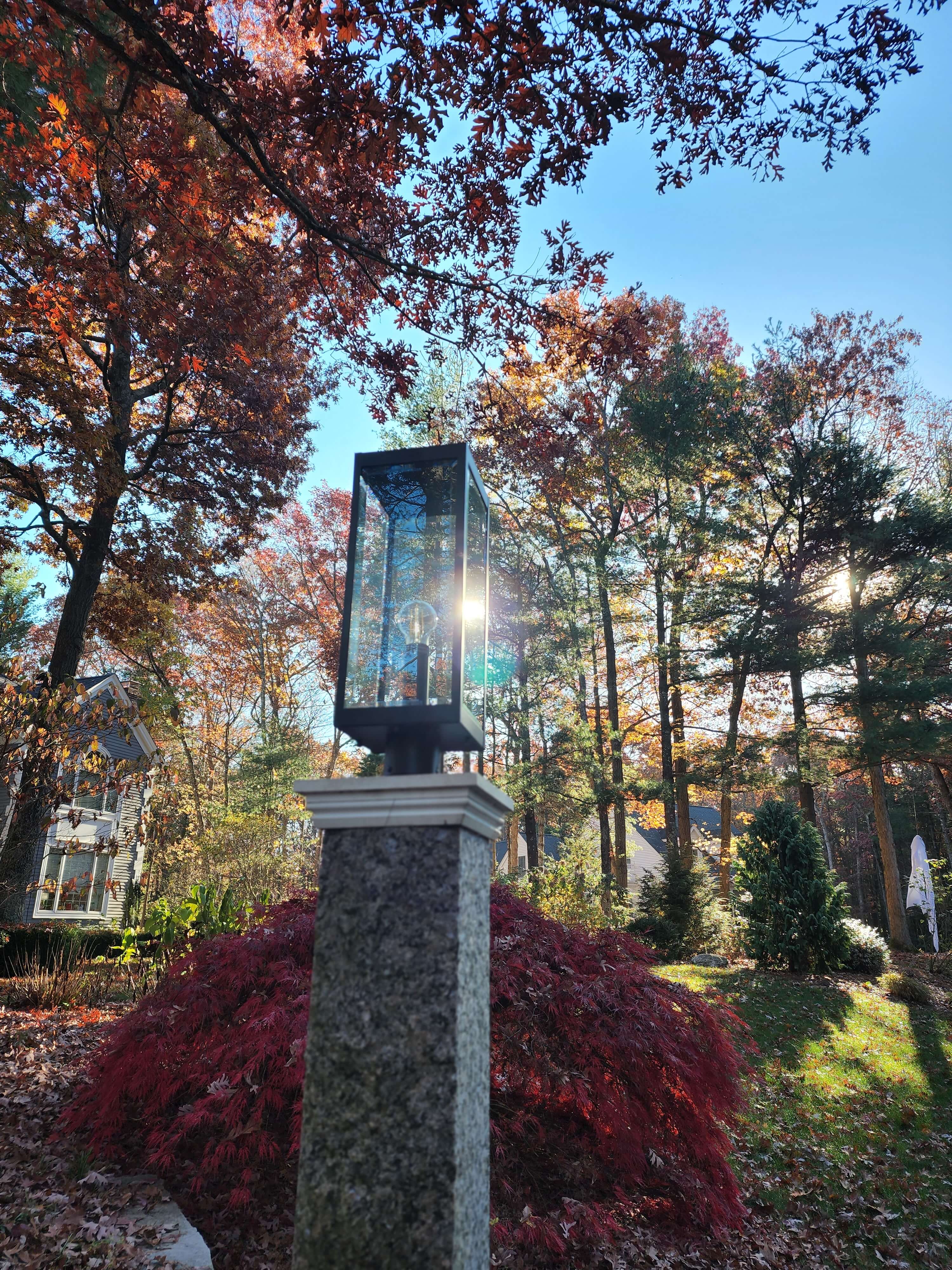 Outdoor landscape post light with glass lantern