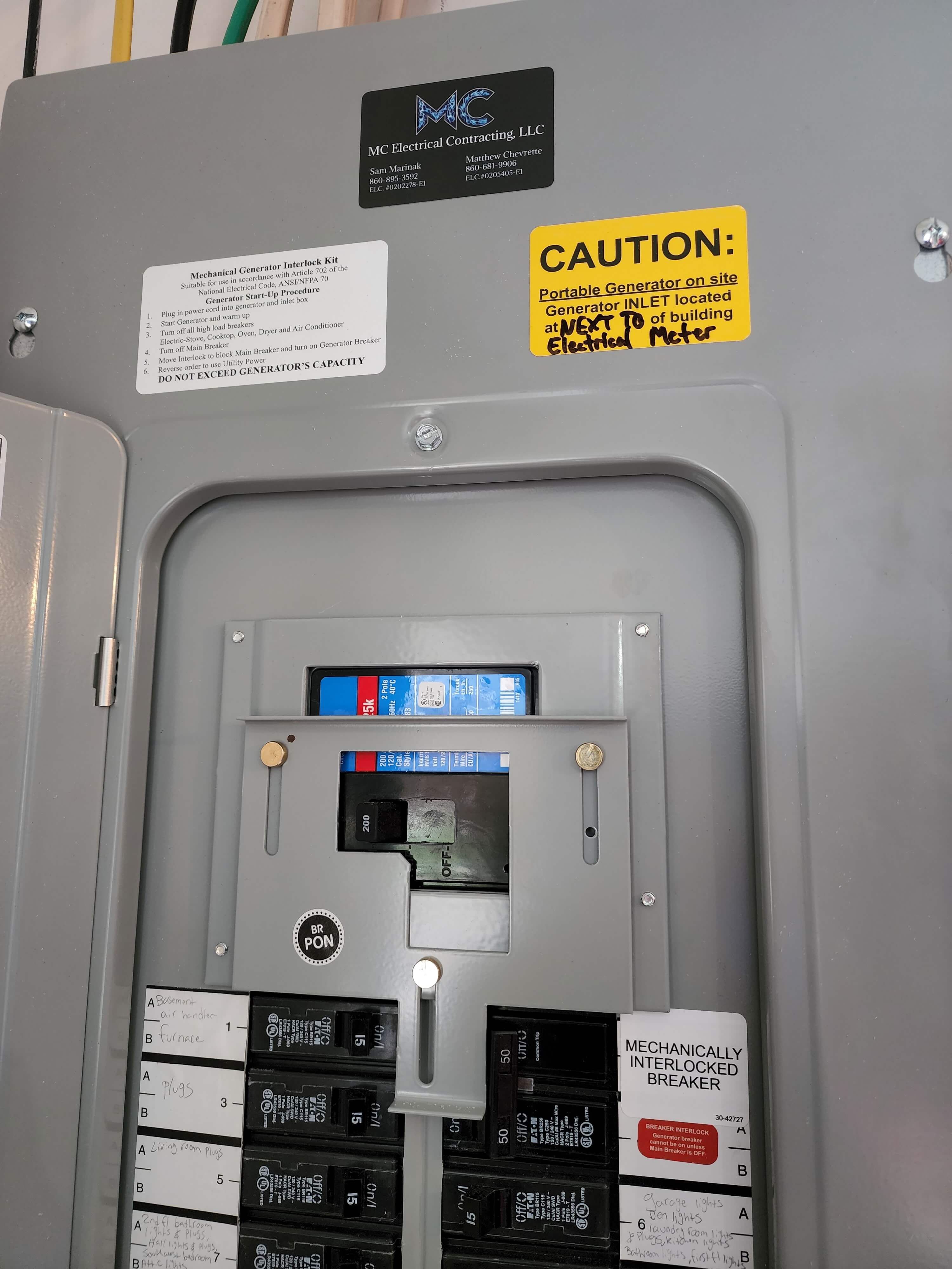 Panel with MC Electrical branding and generator interlock setup