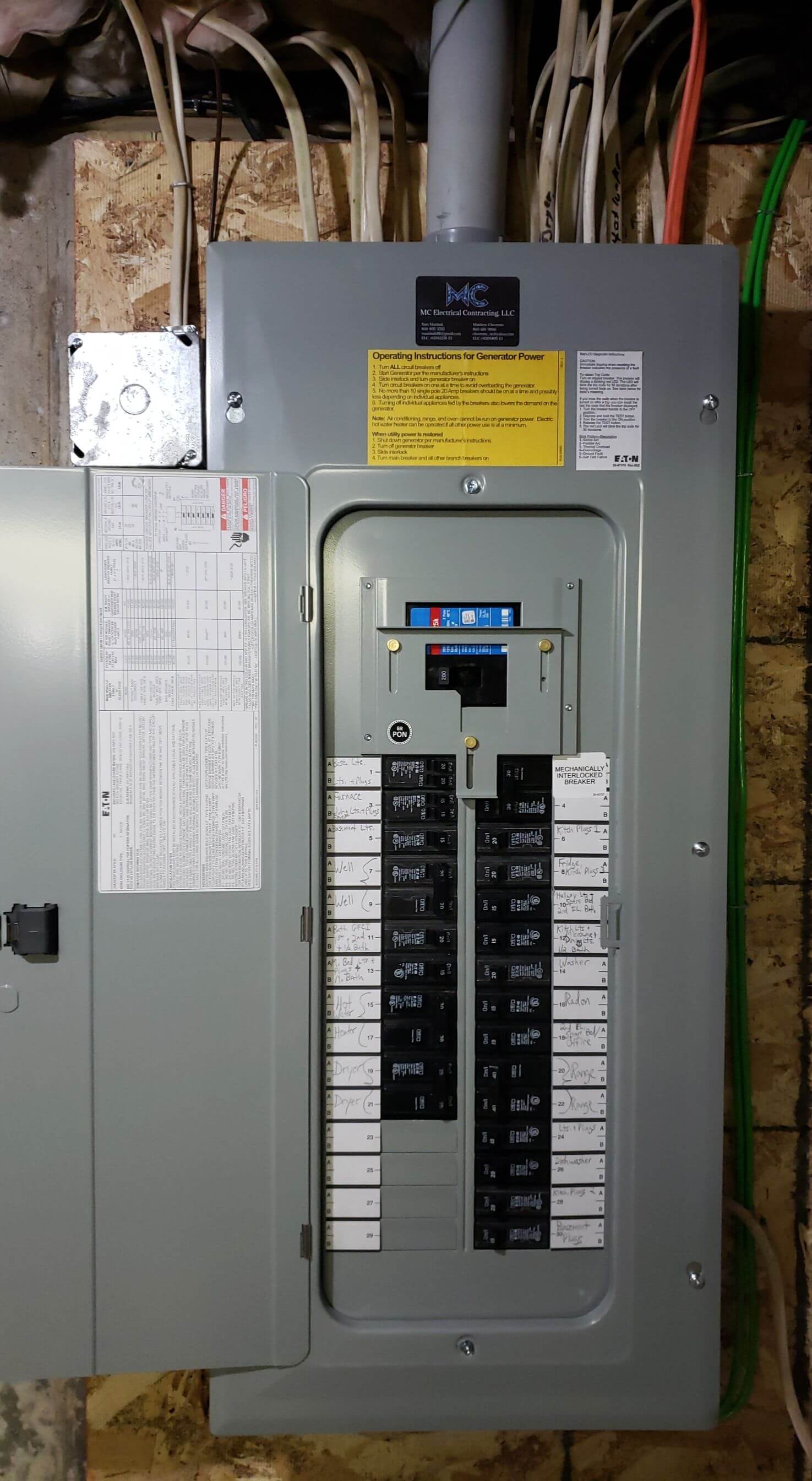 Electrical panel with MC Electrical Contracting branding and generator instructions