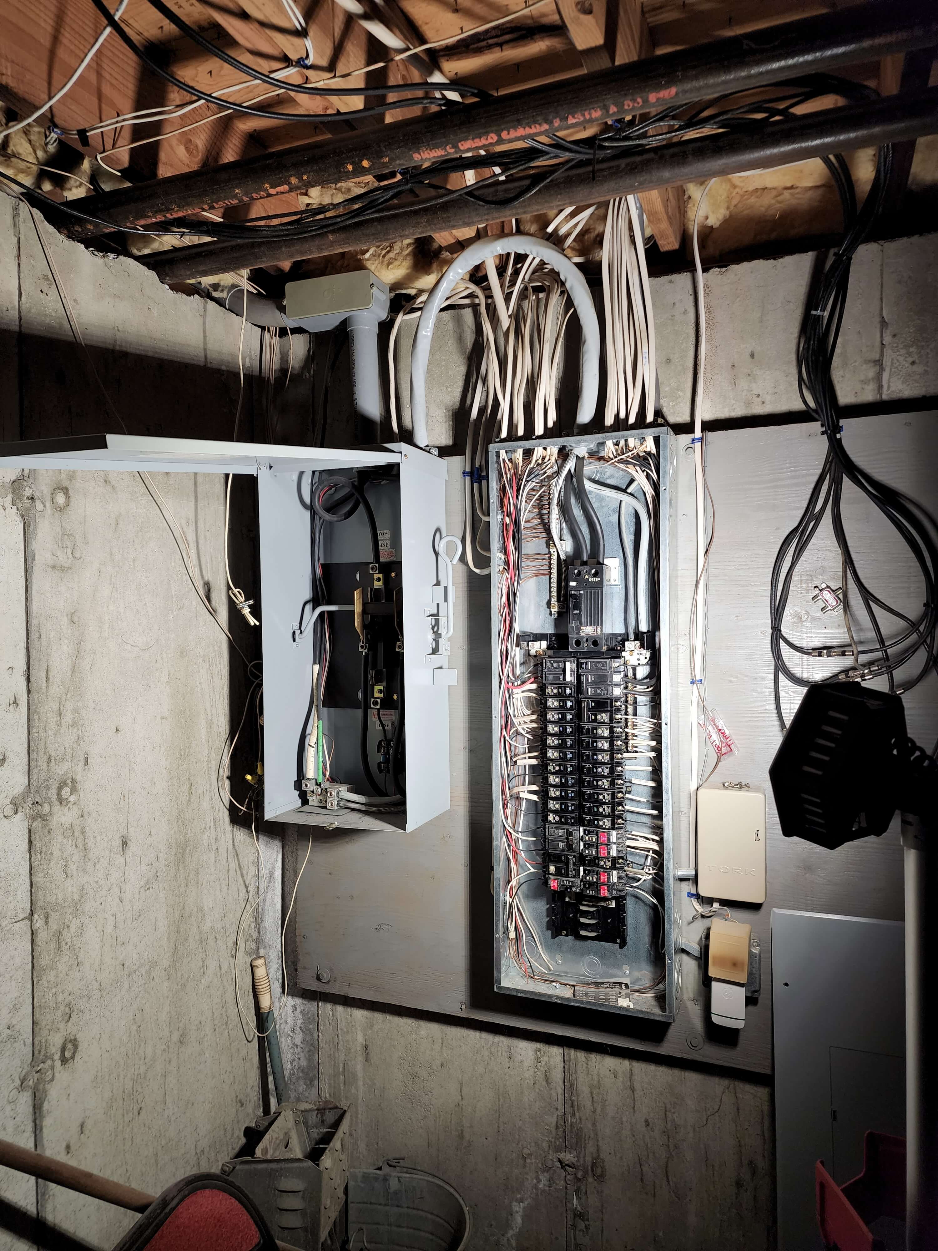 Open electrical panels showing organized breakers and wiring