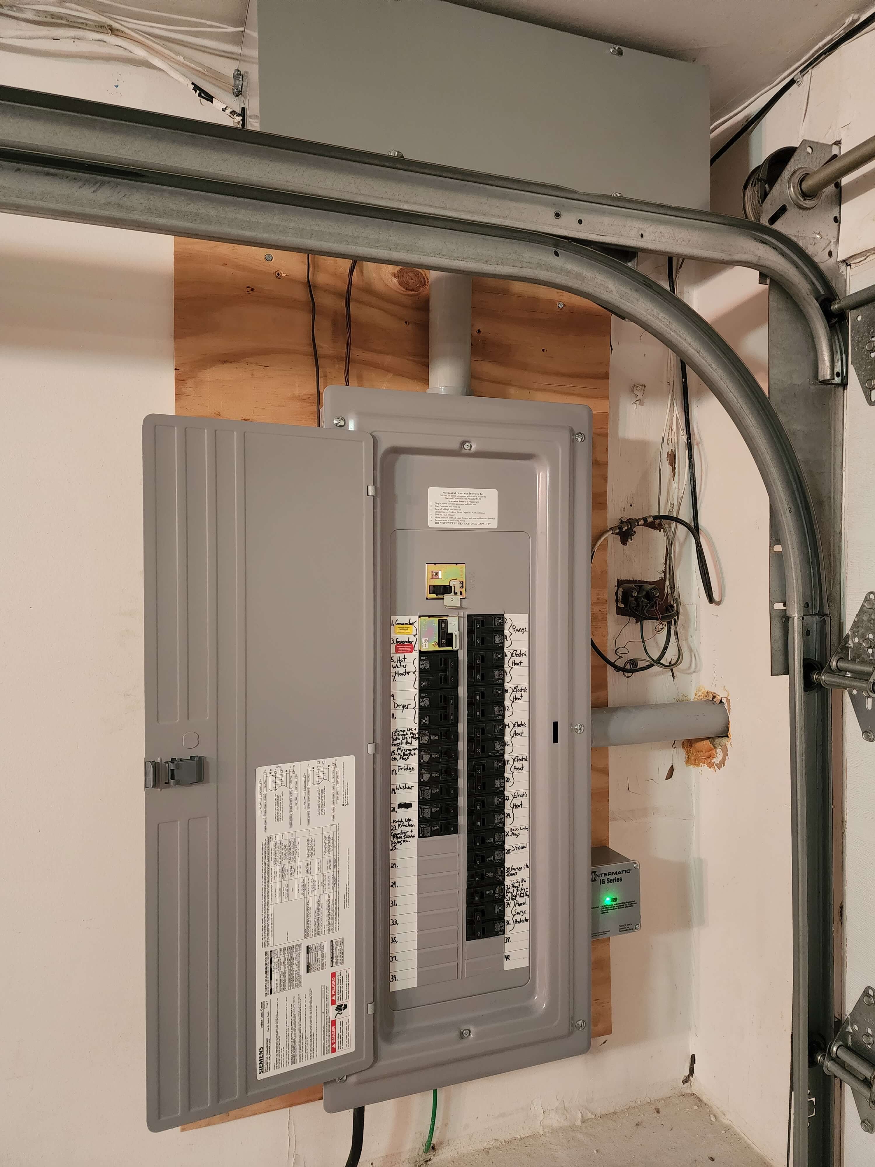 Siemens electrical panel with surge protector in garage