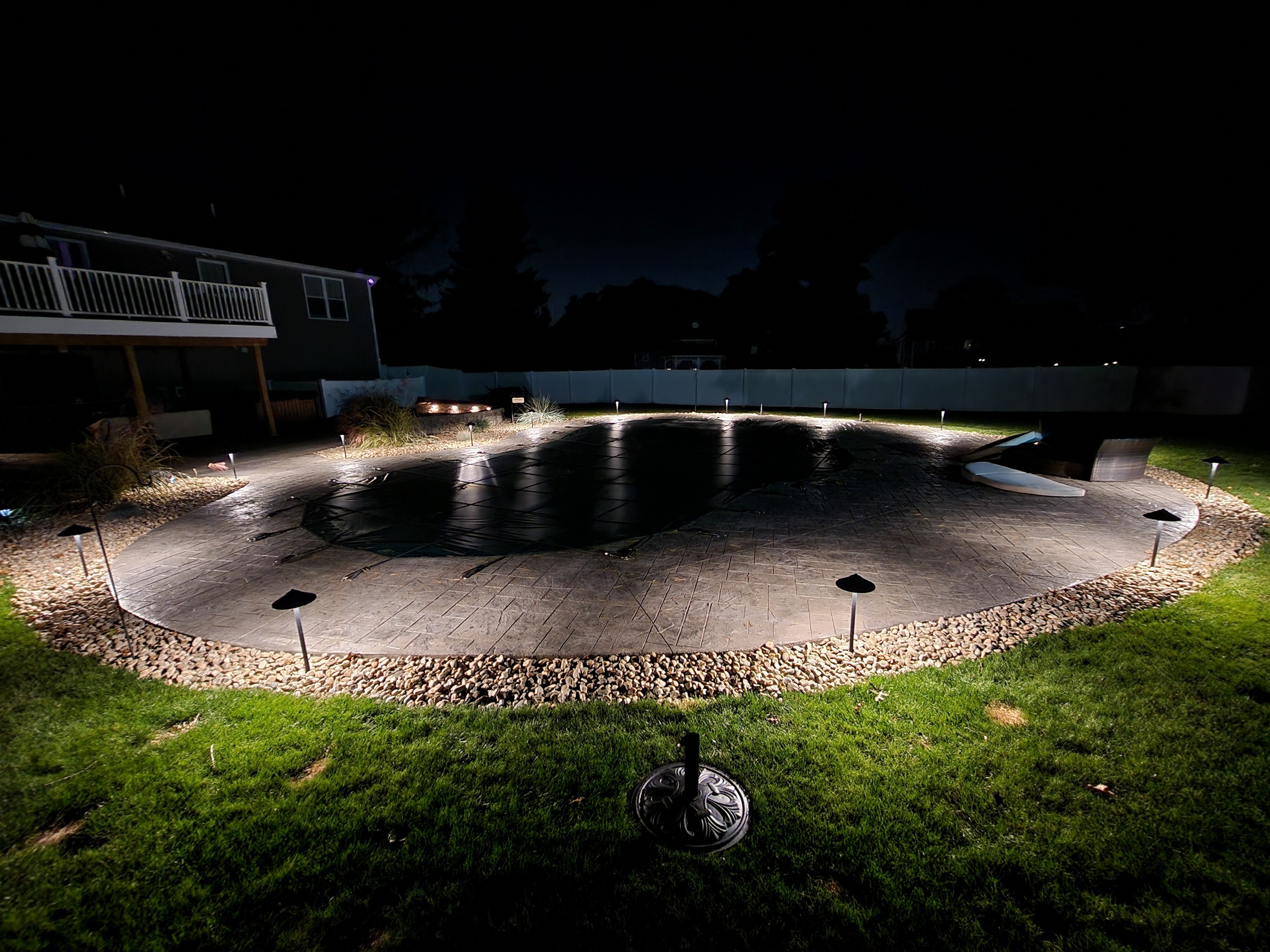 Complete pool patio with pathway lighting installation