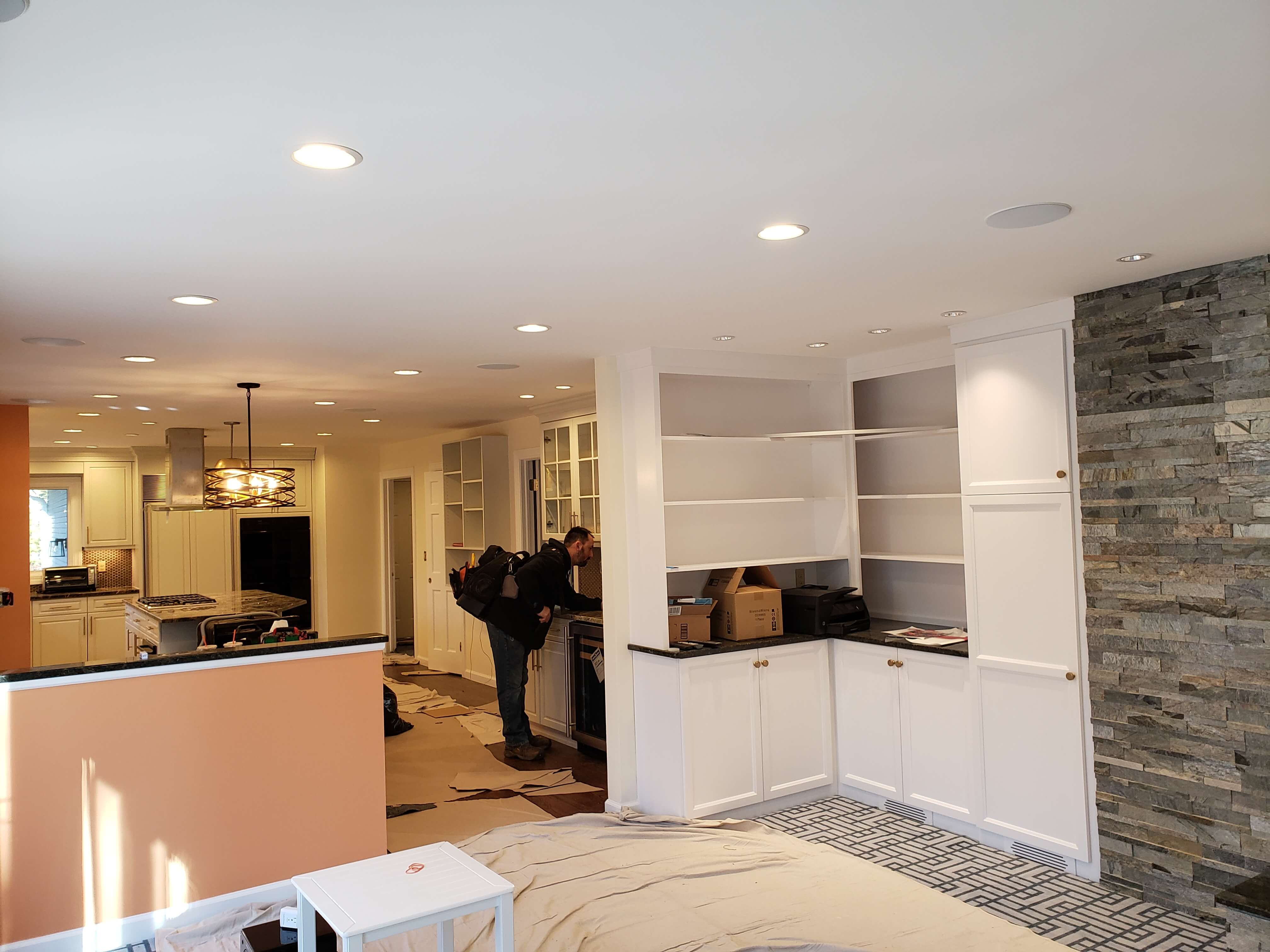 Home renovation with recessed lighting installation throughout